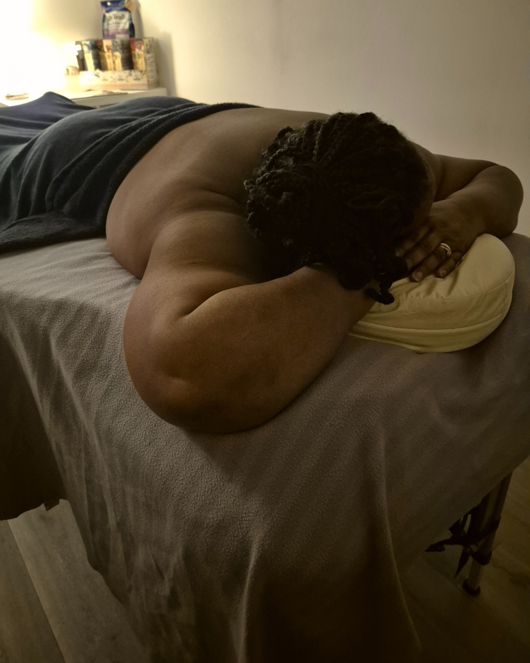 Adapted massage position with breast and head pillows